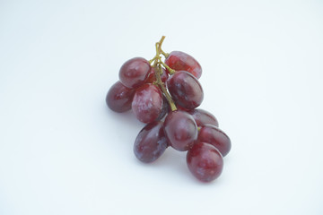 Fresh bunch of grapes on white background.