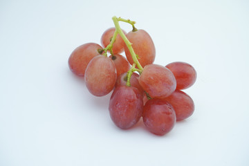 Fresh bunch of grapes on white background.