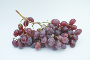 Fresh bunch of grapes on white background.