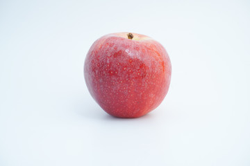 Fresh red apple on white background.