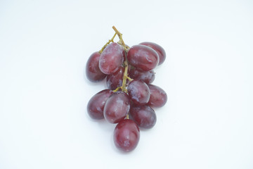 Fresh bunch of grapes on white background.