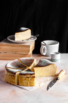Basque burnt cheesecake with a cup of coffee on the table