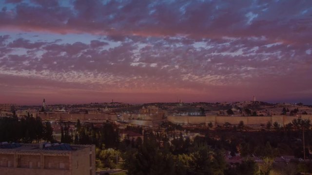 The a time lapse of the old city of Jerusalem from day to night in Israel.