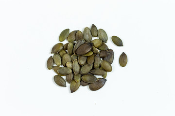 Pumpkin seeds on white background