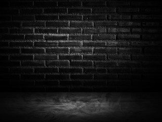 dark room with brick wall and wooden floor