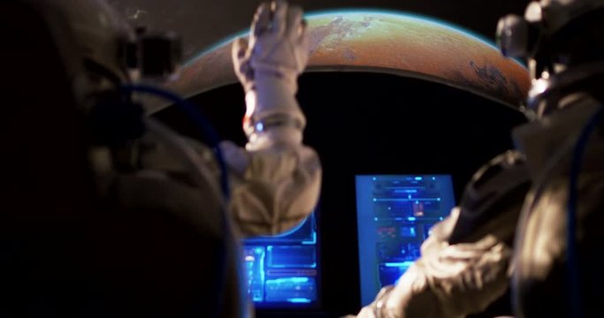 Astronauts approaching Mars with spaceship