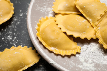 Ravioli on grey table, closeup view. Italian pasta