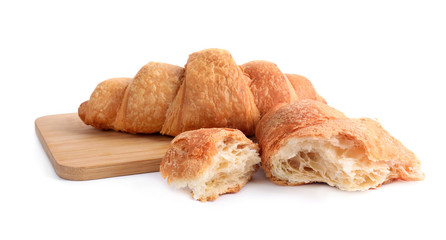 Tasty fresh crispy croissants on white background