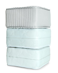 Samples of modern orthopedic mattress on white background