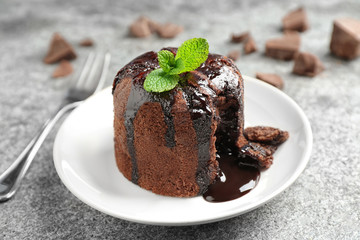 Delicious warm chocolate lava cake on grey table