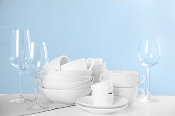 Set of clean tableware on light table