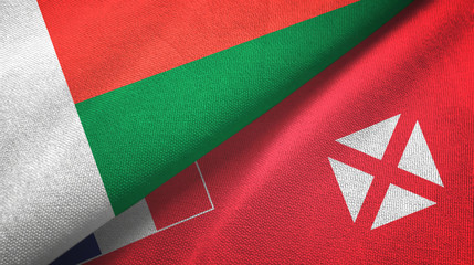 Madagascar and Wallis and Futuna two flags textile cloth, fabric texture
