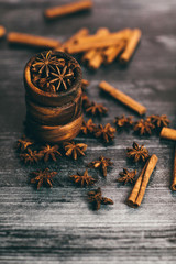 cinnamon sticks and spices on wooden table