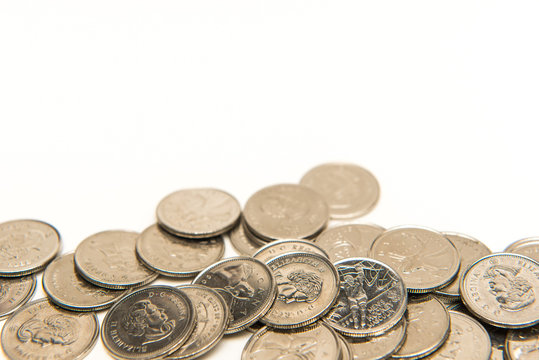 Canadian Quarters Isolated On White Background With Copy Space.