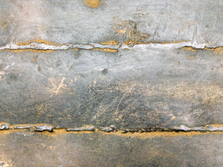 texture of weathered rusty iron with welded seams. industrial background