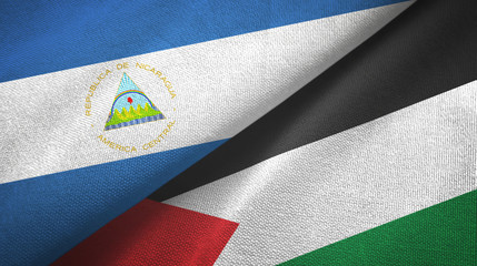 Nicaragua and Palestine two flags textile cloth, fabric texture