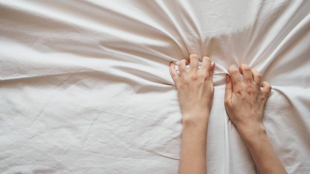 girlhands on the bed fit into the white sheet during sex