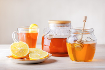 Fruit and herbal tea with lemon and honey. Healthy drink concept.