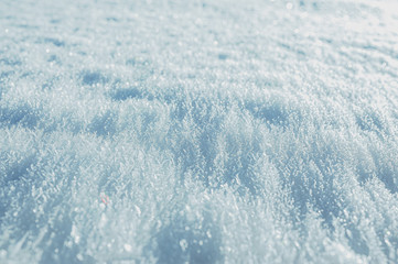 unusual snow cover of white color consisting of fluffy snow and crystallized ice on top, ice land...