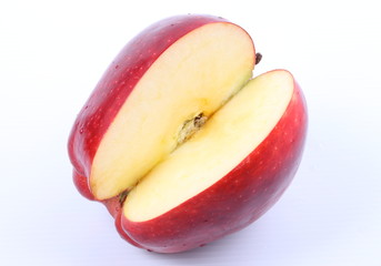 Red apple with water drops isolated on white background.