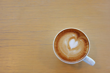 hot latte coffee drink put on wooden table in cafe restaurant