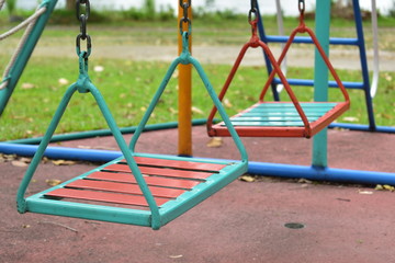 swing steel seat in playground for kid playing in outdoor park
