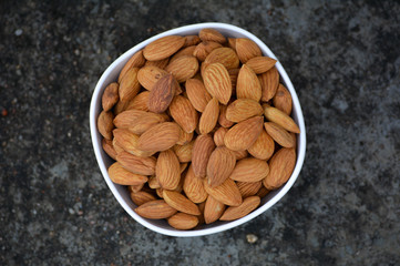 Tasty almond in white bowl
