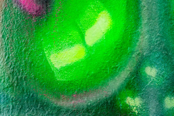 Beautiful bright colorful street art graffiti background. Abstract creative spray drawing fashion colors on the walls of the city. Urban Culture, pink , red , orange , yellow, green,  purple texture