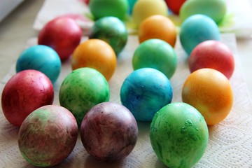 Fototapeta na wymiar conveyor belt on easter eggs coloring. multicolor easter eggs in row, holidays concept
