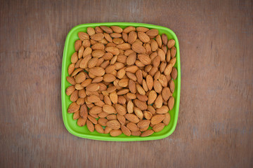 Almond nuts on wood background