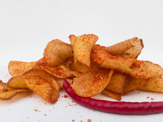 cassava chips are snacks made from cassava slices then fried, then seasoned with a spicy flavor. very suitable for packaging photos because of white background