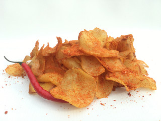 cassava chips are snacks made from cassava slices then fried, then seasoned with a spicy flavor. very suitable for packaging photos because of white background