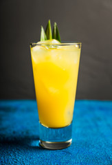 Pineapple cocktail in highball glass. Selective focus. Shallow depth of field.