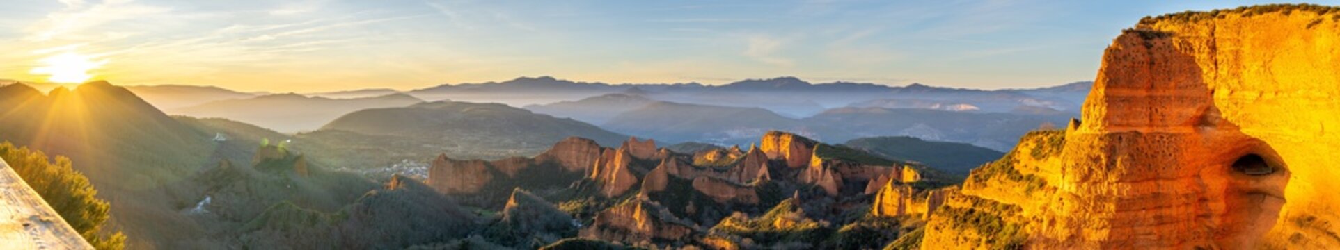 Panoramic shot of mountains and cliffs with the sun shining in the background in Las M&Atilde;&copy;dulas, Spain