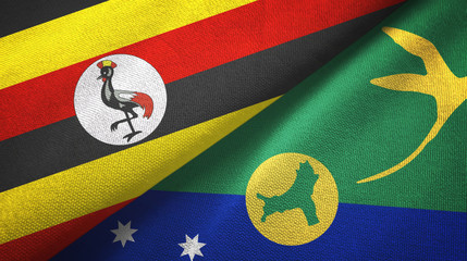 Fototapeta premium Uganda and Christmas Island two flags textile cloth, fabric texture