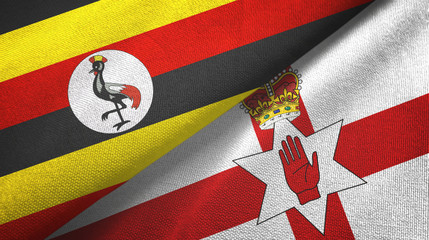 Fototapeta premium Uganda and Northern Ireland two flags textile cloth, fabric texture