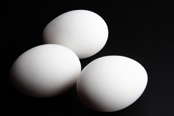 Three egg in black background