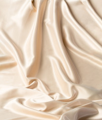 Abstract white wavy textile silk background with milky, creamy, champagne color
