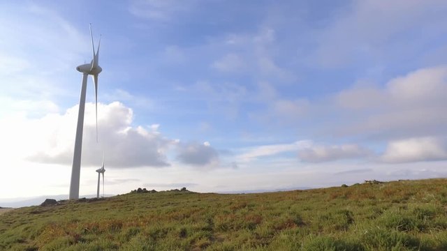eolic turbine wind renewable energy farm on top of mountain 4k