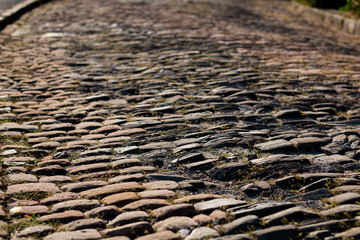 Ancient ruined paved cobblestone street high angle view