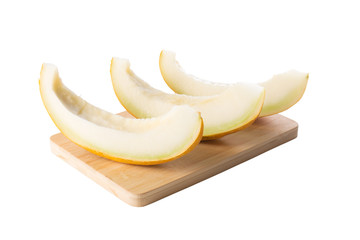 Sliced of fresh melon on wooden board isolated white background. Angle view