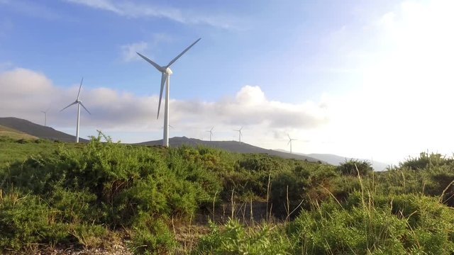 eolic turbine wind renewable energy farm on top of mountain 4k