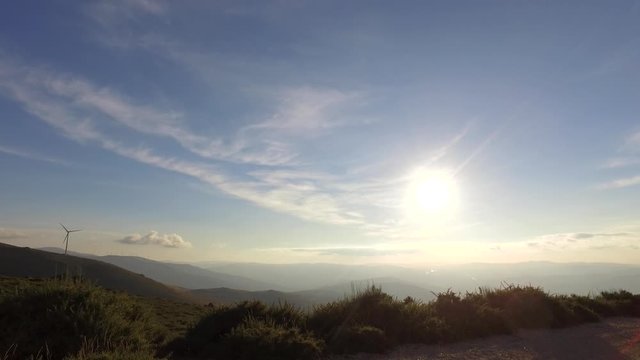 eolic turbine wind renewable energy farm on top of mountain 4k