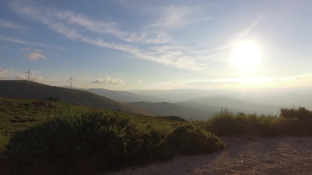 eolic turbine wind renewable energy farm on top of mountain 4k