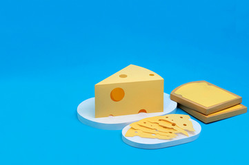 Paper toasts, triangular piece and slices of Maasdam cheese