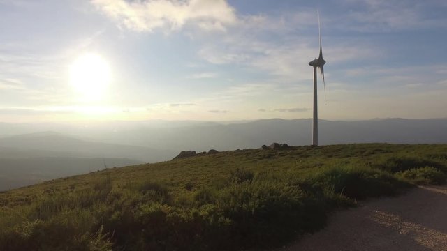 eolic turbine wind renewable energy farm on top of mountain 4k