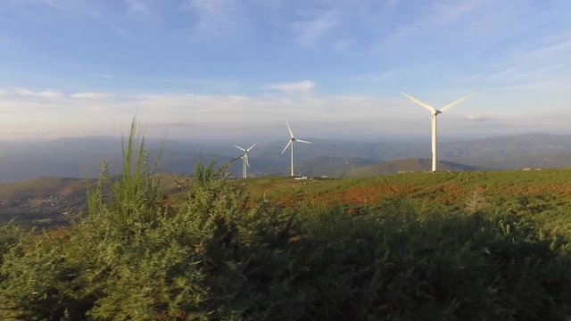 eolic turbine wind renewable energy farm on top of mountain 4k