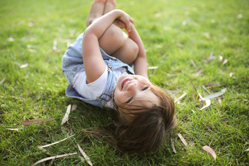 Funny summer emotional child on grass, outdoor
