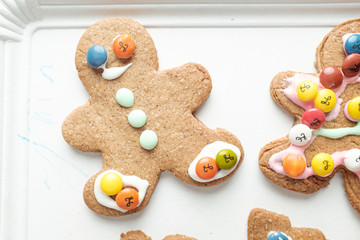 Handmade different shaped tasty cookies on a white shelf