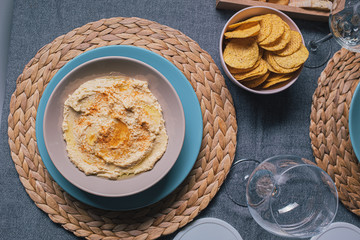 Hummus dipping sauce served with toasts on a tableware